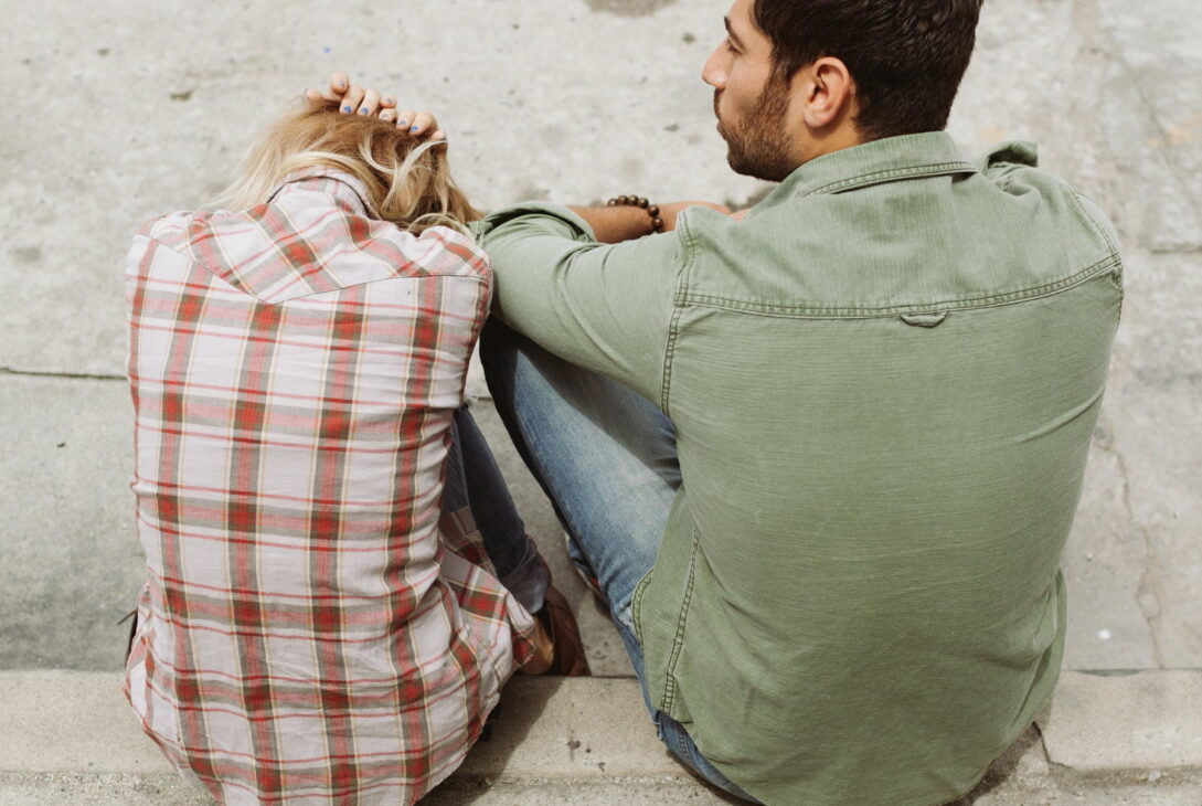 man and woman sitting on sidewalk 226166 - voozon.com