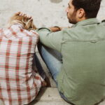 man and woman sitting on sidewalk 226166 - voozon.com